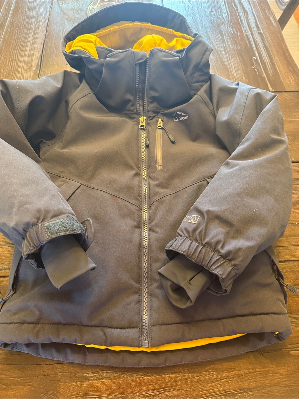 L.L. Bean Kids navy puffer ski Jacket with Yellow Lining.